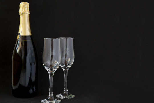 Champagne bottle with champagne glasses.
