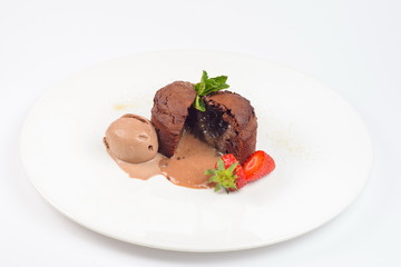 brownie with strawberries on a white plate
