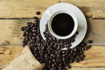 Black coffee with spilled coffee beans