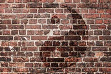 Chinese yin yang sign on an old brick wall