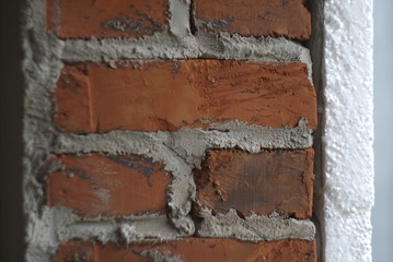 insulation of a brick wall with polystyrene white