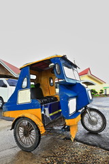 Obraz premium Colorist tricycle at the Chocolate Hills Complex parkng lot. Carmen-Bohol island-Philippines-0612