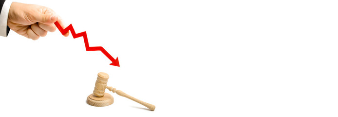 The hand holds the arrow down near the judge's hammer. lowering the percentage of accusatory or...