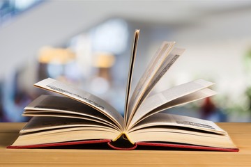 Open white book on background