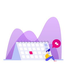 A young man sits near the calendar and communicates by phone