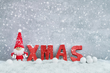 Christmas greeting card. Santa gnome background with Christmas decoration and snow. Christmas symbol.