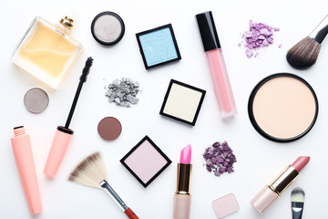 Different makeup cosmetics on white background