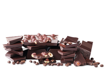 Chocolate pieces with hazelnuts and coffee beans isolated on white background