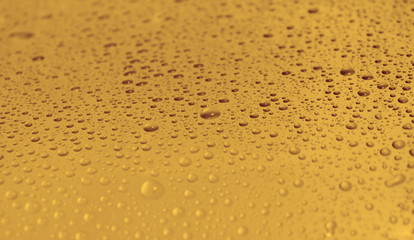natural water drops on yellow golden background texture