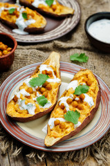 Roasted chickpeas stuffed sweet potato with Greek yogurt cilantro lime dressing