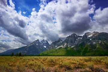 Wyoming's towering Grand Tetons against a stormy sky