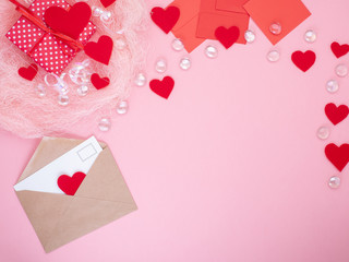 gift in red gift box with bow, smart phone, envelope, card, red heart, pink background, flat lay, copy space, mockup