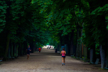 Joggers in Paris Public Park