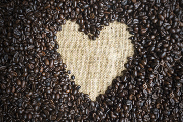 Heart shape on heap coffee beans
