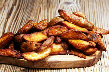 Baked potato wedges. homemade organic vegetable vegan vegetarian potato wedges snack food