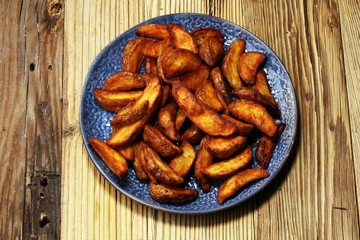 Baked potato wedges. homemade organic vegetable vegan vegetarian potato wedges snack food