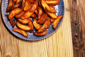 Baked potato wedges. homemade organic vegetable vegan vegetarian potato wedges snack food