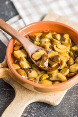 Pickled mushrooms. Marinated boletus.