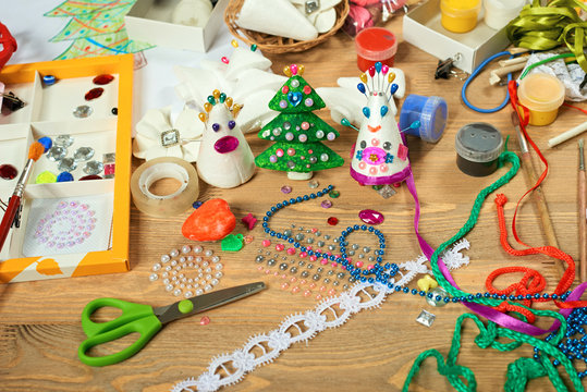 Handmade decorations for new year and other holidays. Artwork workplace with creative accessories.