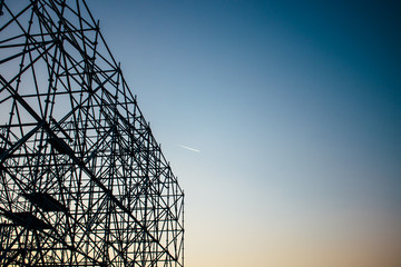 Abstract silhouette of scaffolding against the sunset sky