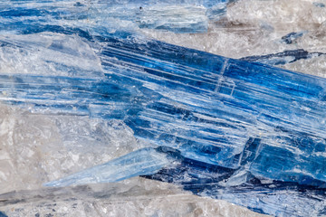 Macro mineral stone Kyanite a white background