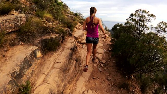 Woman hiking on Cape Town mountain, POV