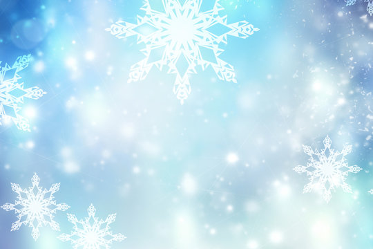 Blue blurred winter snowflakes background,christmas backdrop.
