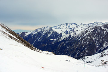high snowy mountains in cloudy day