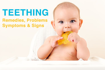 Cute baby infant kid biting sitting in highchair and chewing yellow eething toy copy space bright...