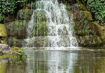 the old waterfall with pond in the Park day