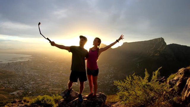 Sunset over hiking couple in Cape Town, wide