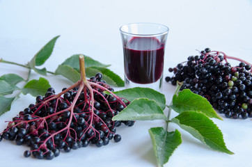 Elderberry vinegar on white background