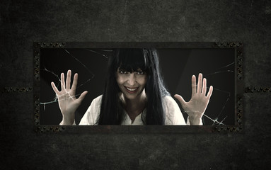 Mad crasy halloween woman in psychiatric hospital