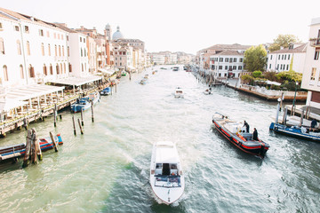 Fototapeta na wymiar Venice Panorama. View on canal with boat and motorboat water. Picturesque landscape. Panoramic cityscape image of Venice, Italy.