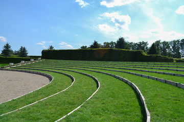 Green grass amphitheater in Europe under the clouds