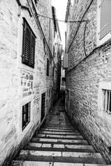 Obraz premium Small black and white street in old town in Europe