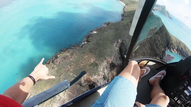 POV, helicopter flies over scenic island in Australia