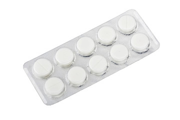 Medical pills in silver blister packs isolated on white background