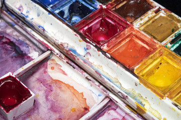 Watercolour Palette Close Up Messy Paints on Black Background