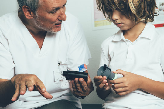 Doctor helping with an insulin pump to a child