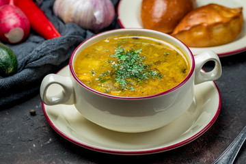 Chicken soup bouillon in a plate