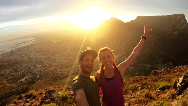 POV, couple overlooking Cape Town at sunset