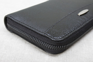 lightning on a purse close-up; closed black purse