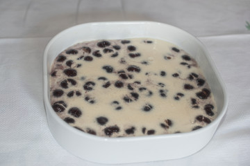 Clafoutis with Cherry. Red and ripe cherries. Preparation and close-up.