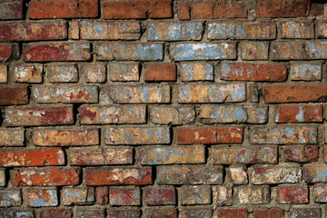 Texture of old brick wall with shabby paint