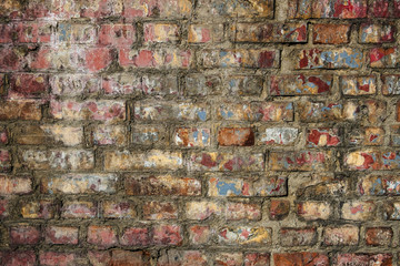 Texture of old brick wall with shabby paint