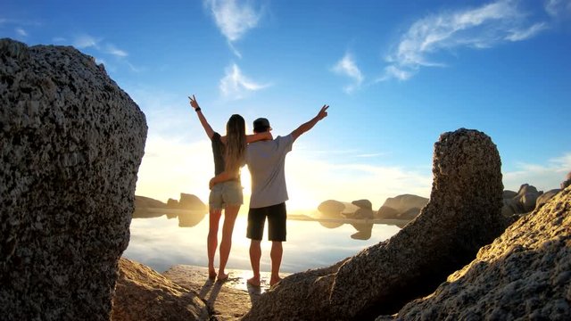 POV, couple poses at sunset