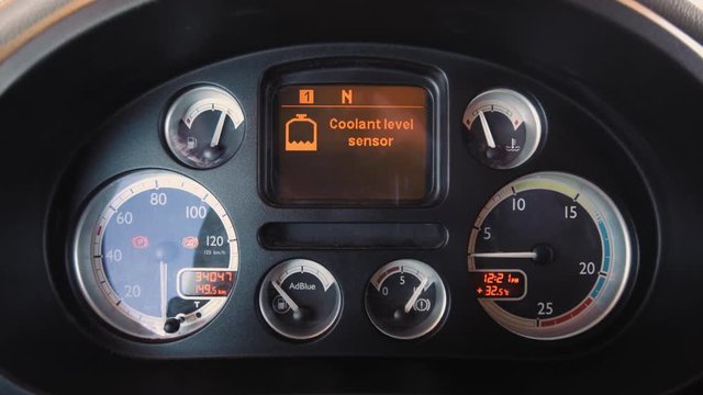 DAF XF Truck Interior Dashboard. Close shot. Start engine. Warning message coolant level sensor. 4k footage.