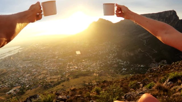POV, drinking out of mug overlooking Cape Town