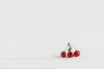 cherry on a light background of wood